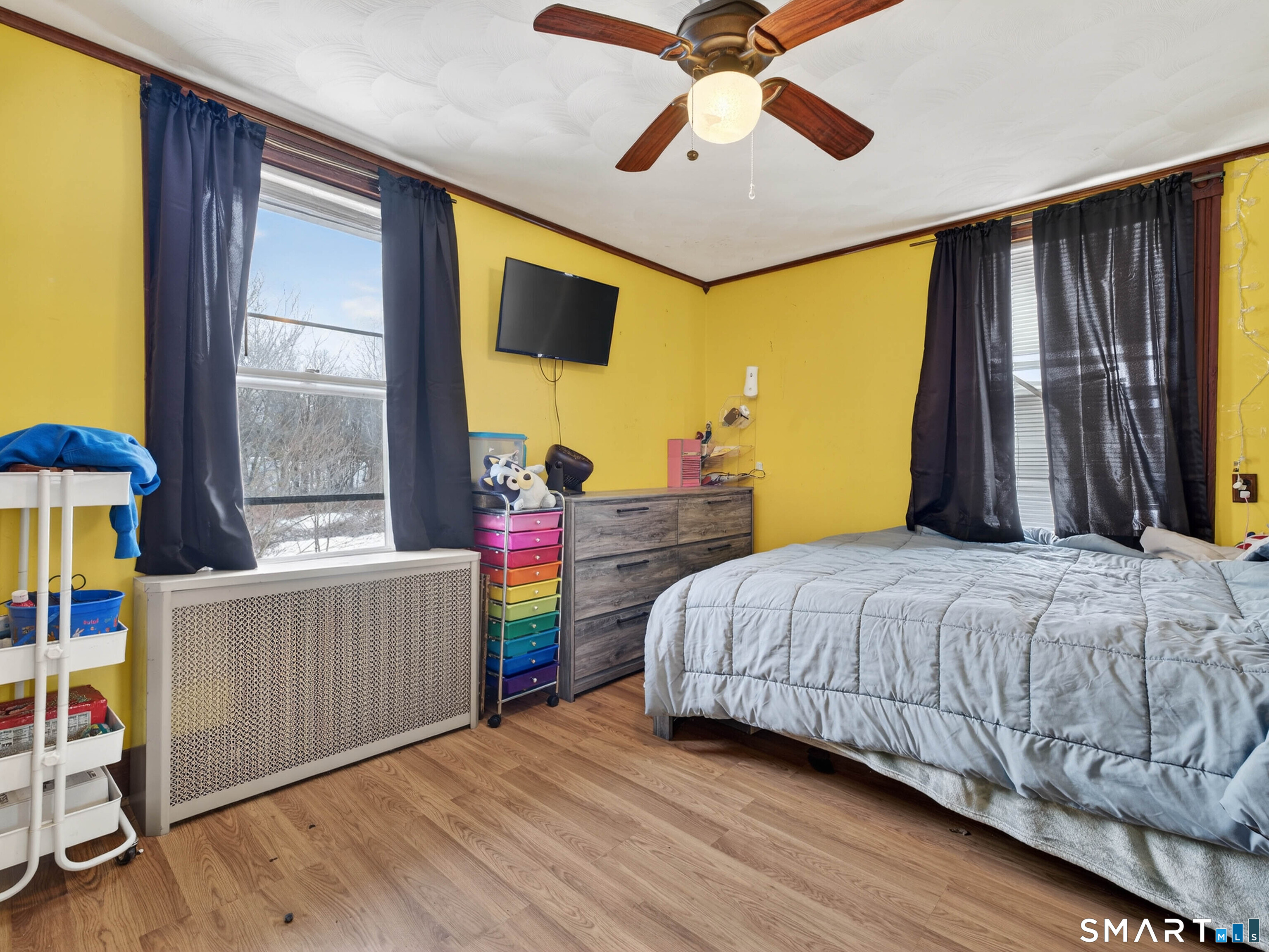 25 Torrey Lane Plainfield, CT 06332 - Photo 19 of 35 a bedroom with a bed and a chandelier