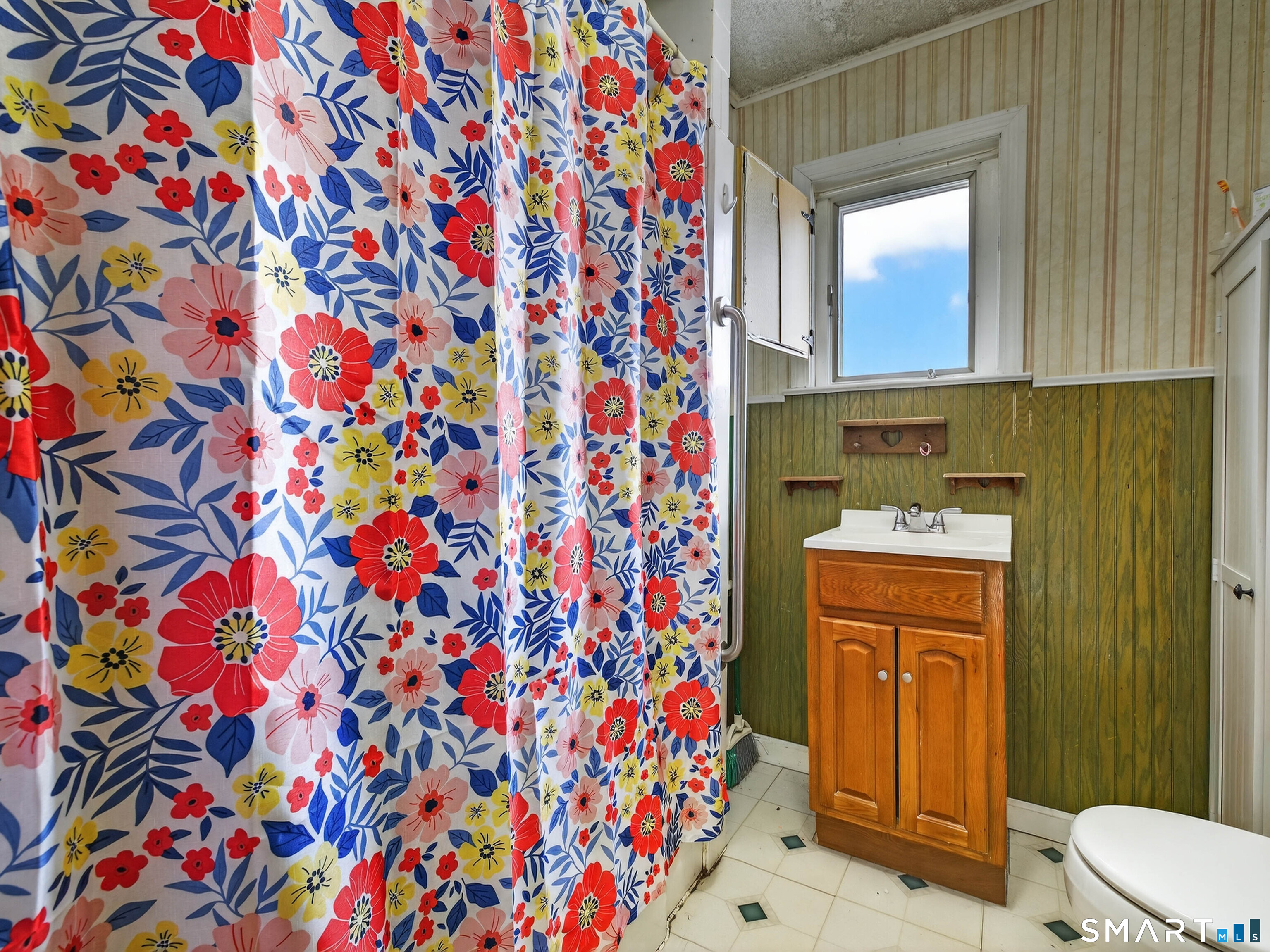 25 Torrey Lane Plainfield, CT 06332 - Photo 24 of 35 a bathroom with a sink and mirror with toilet