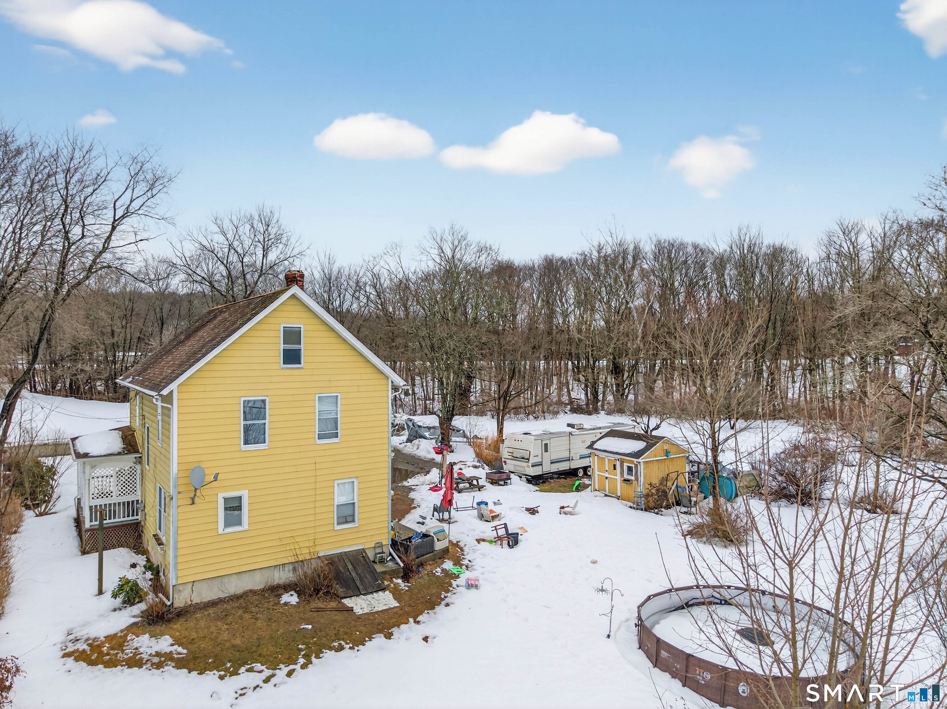 25 Torrey Lane Plainfield, CT 06332 - Photo 29 of 35 a view of a chair and tables in the patio