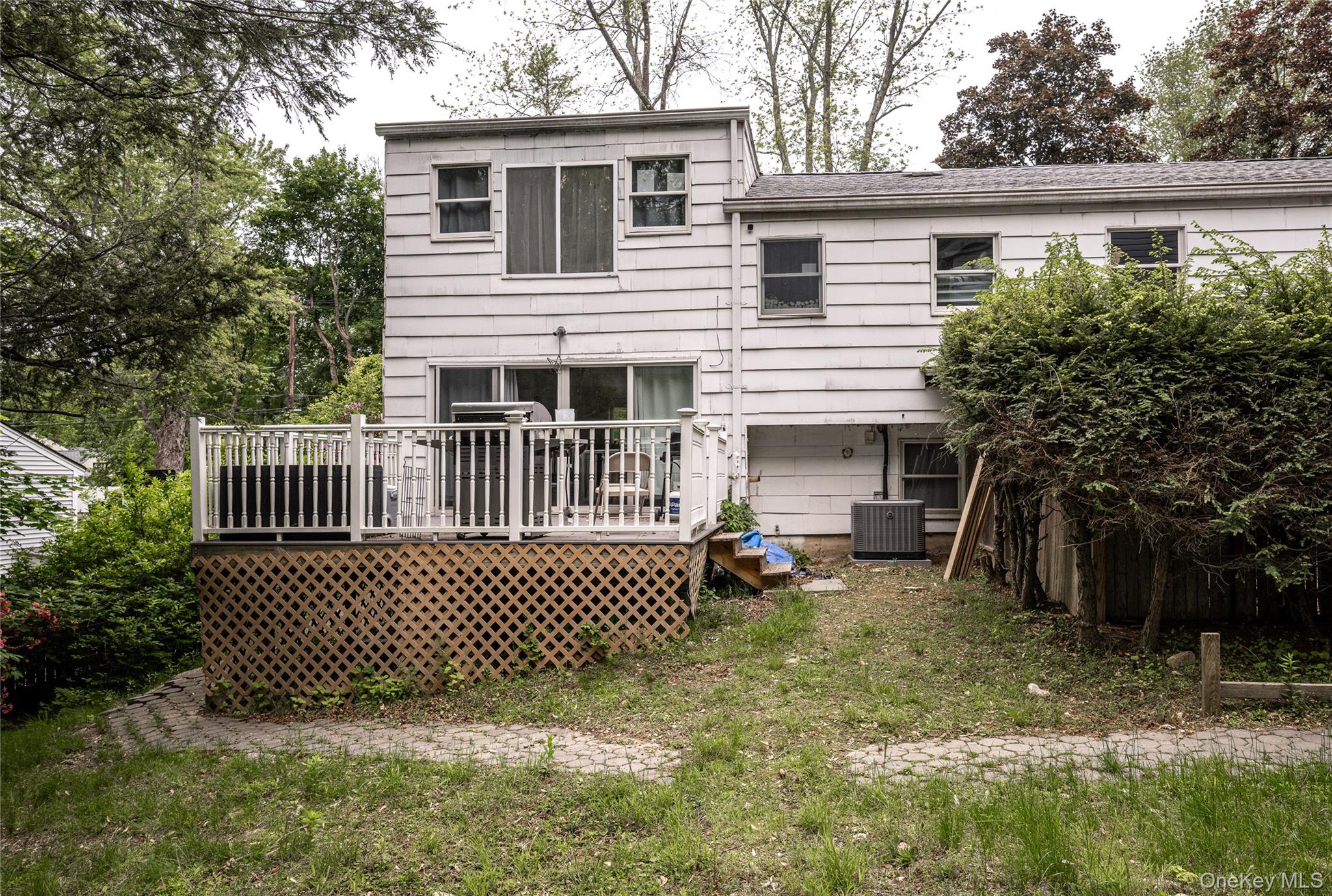 929 Fox Meadow Road Yorktown Heights, NY 10598 - Photo 37 of 39 Back of house featuring a deck and central AC