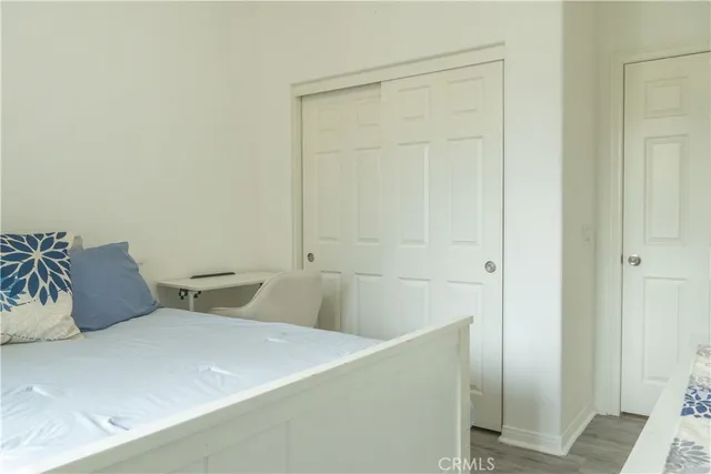 a bedroom with a bed and a shower