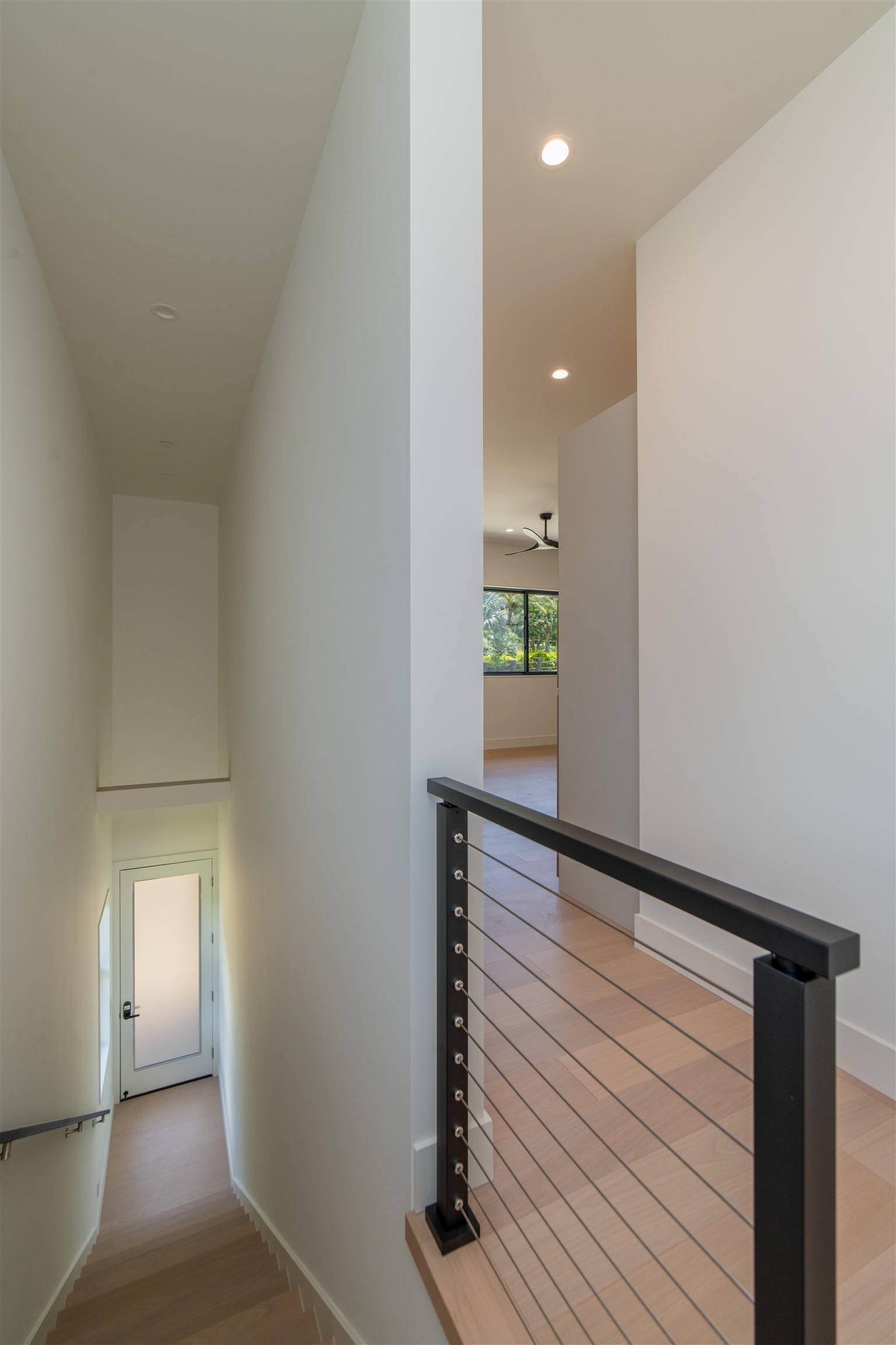 111 Mehana Road, Unit A Haiku, HI 96708 - Photo 41 of 50 a view of a hallway with wooden floor and staircase