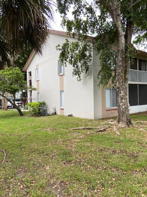 9071 Southwest 141st Place, Unit 9071 Miami, FL 33186 - Photo 2 of 10 a view of a backyard