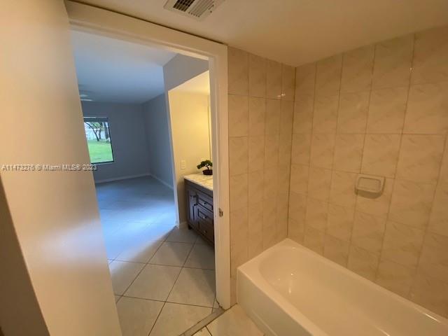 9071 Southwest 141st Place, Unit 9071 Miami, FL 33186 - Photo 10 of 10 a bathroom with a tub and a shower