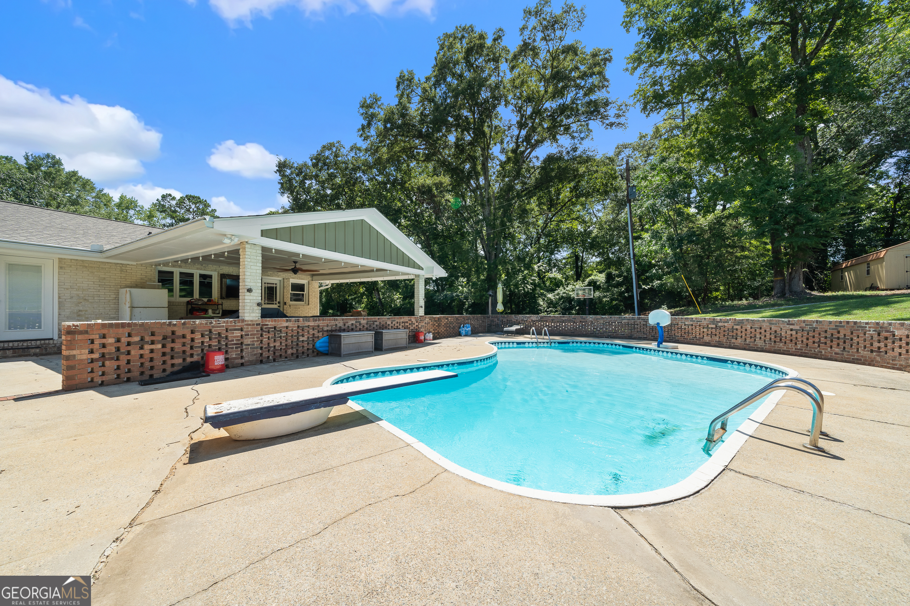 122 Ivey Weaver Road Milledgeville, GA 31061 - Photo 21 of 64 a view of a house with swimming pool