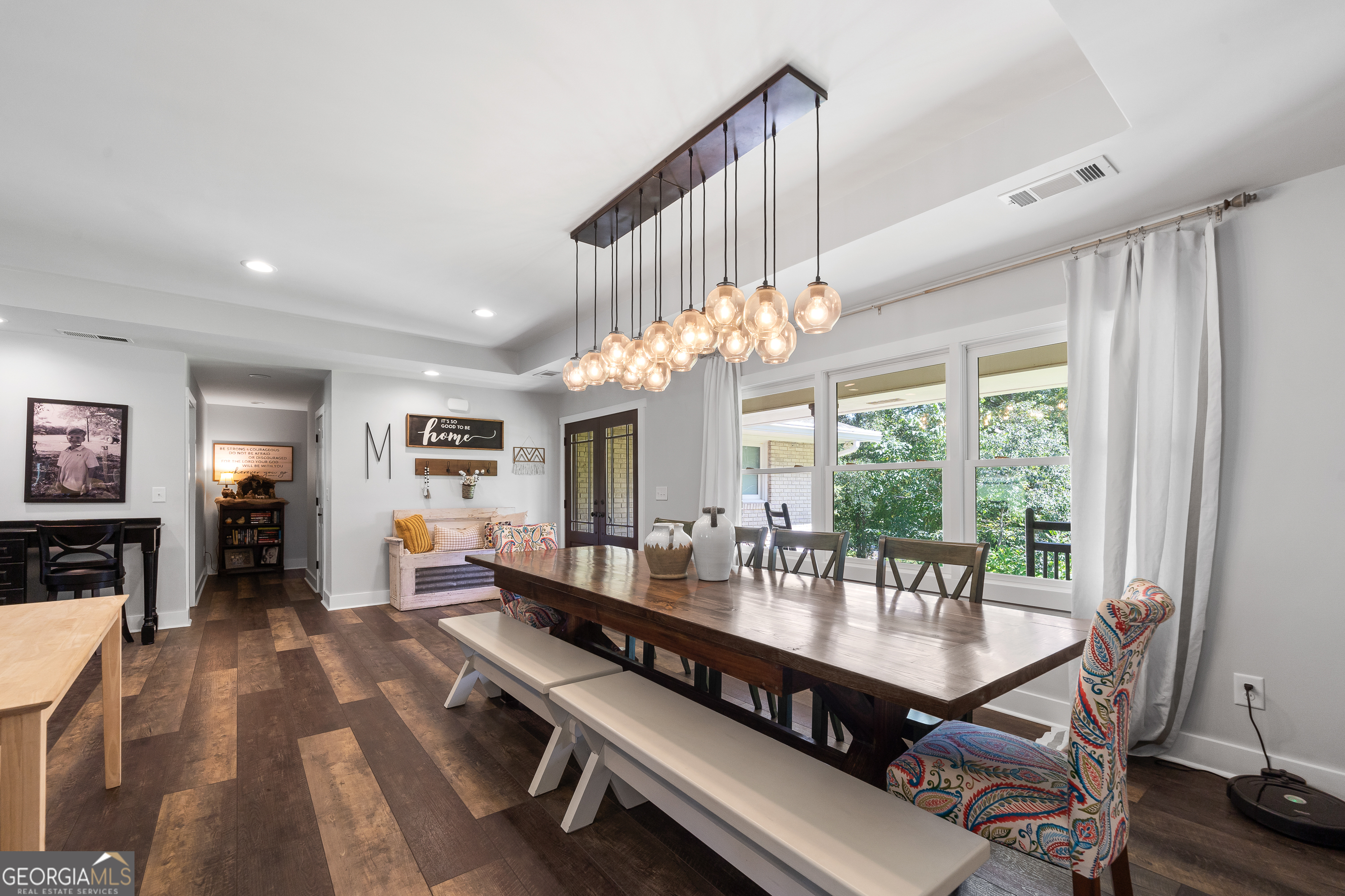 122 Ivey Weaver Road Milledgeville, GA 31061 - Photo 32 of 64 a view of a dining room with furniture a chandelier and wooden floor