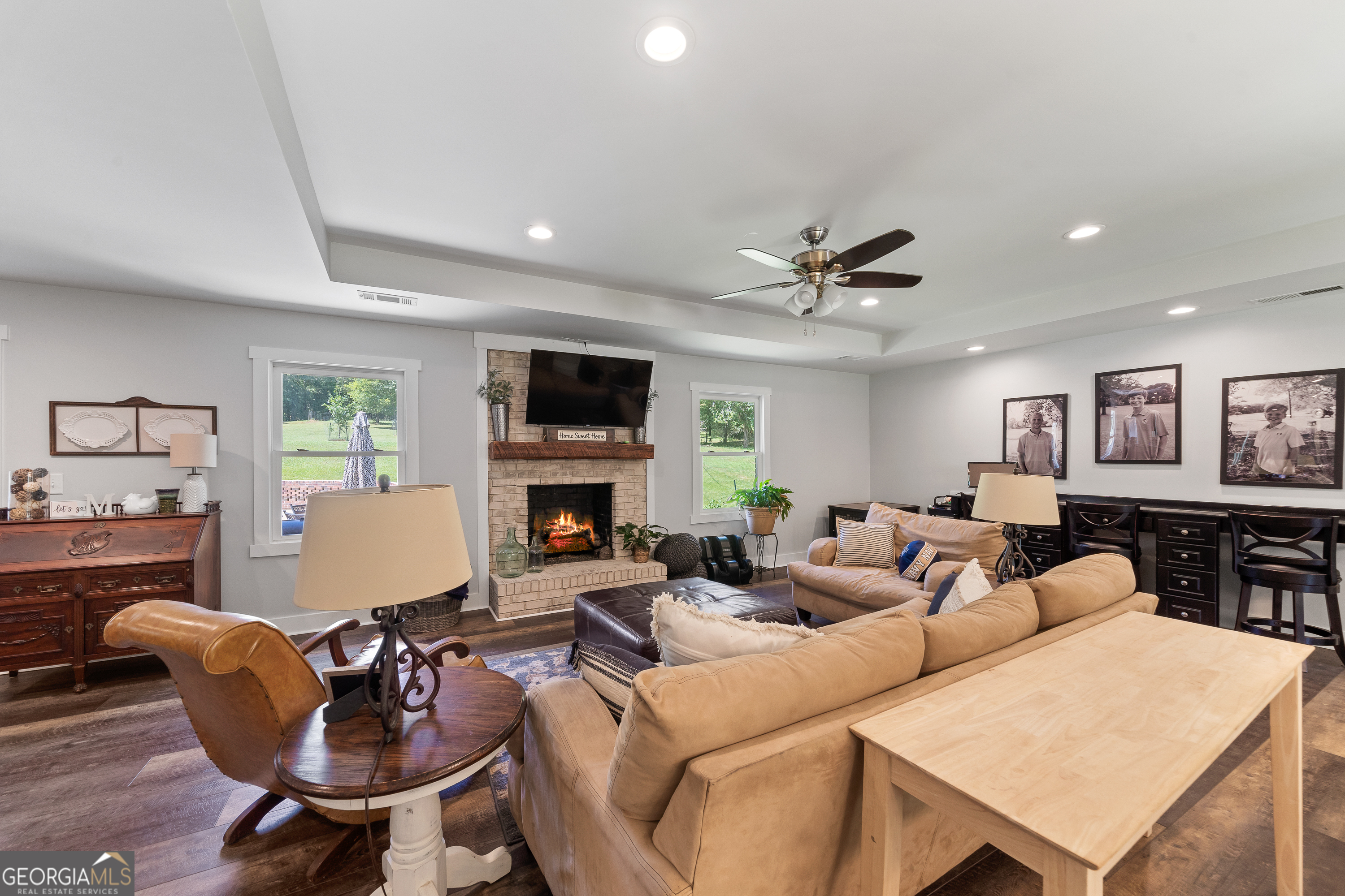 122 Ivey Weaver Road Milledgeville, GA 31061 - Photo 33 of 64 a living room with furniture a fireplace and a flat screen tv