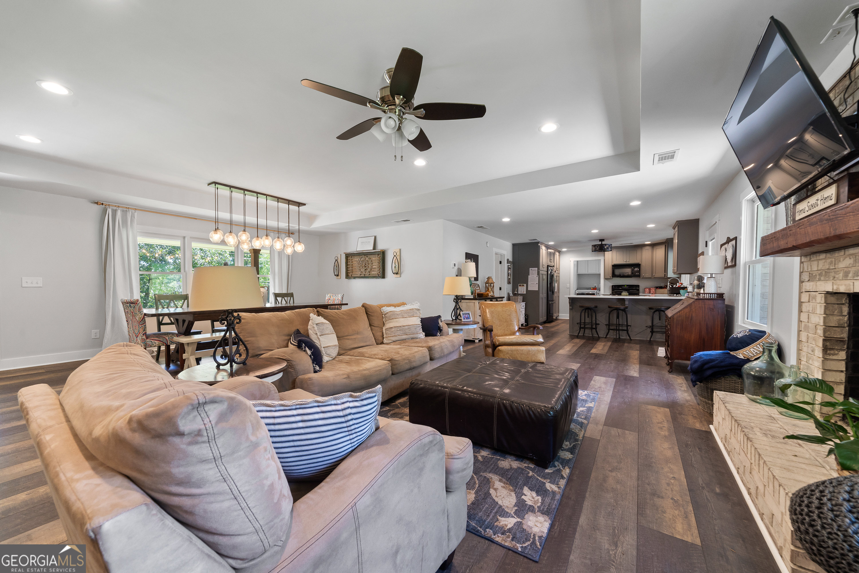 122 Ivey Weaver Road Milledgeville, GA 31061 - Photo 35 of 64 a living room with furniture or couch and a flat screen tv