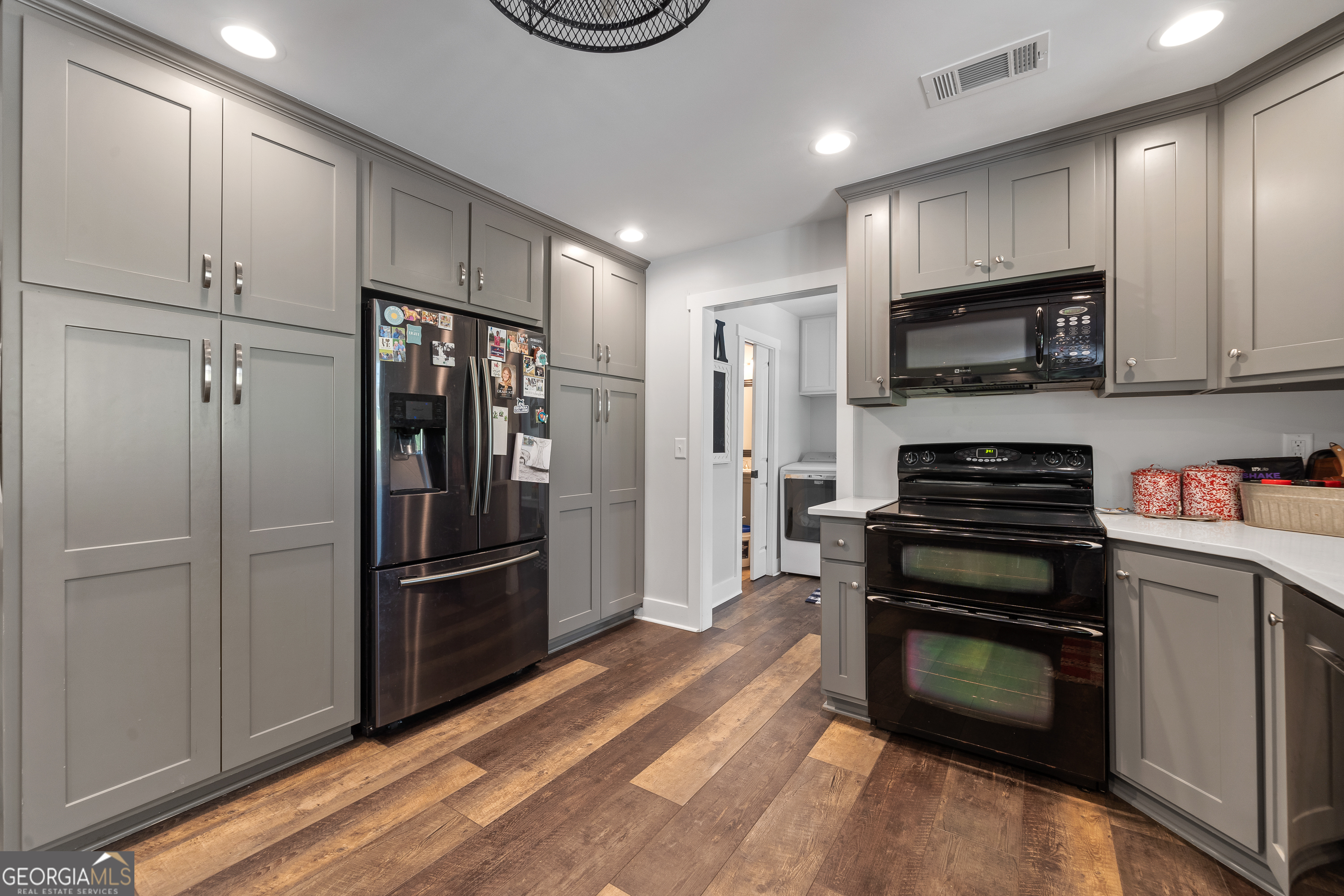 122 Ivey Weaver Road Milledgeville, GA 31061 - Photo 42 of 64 a kitchen with a refrigerator and a stove top oven