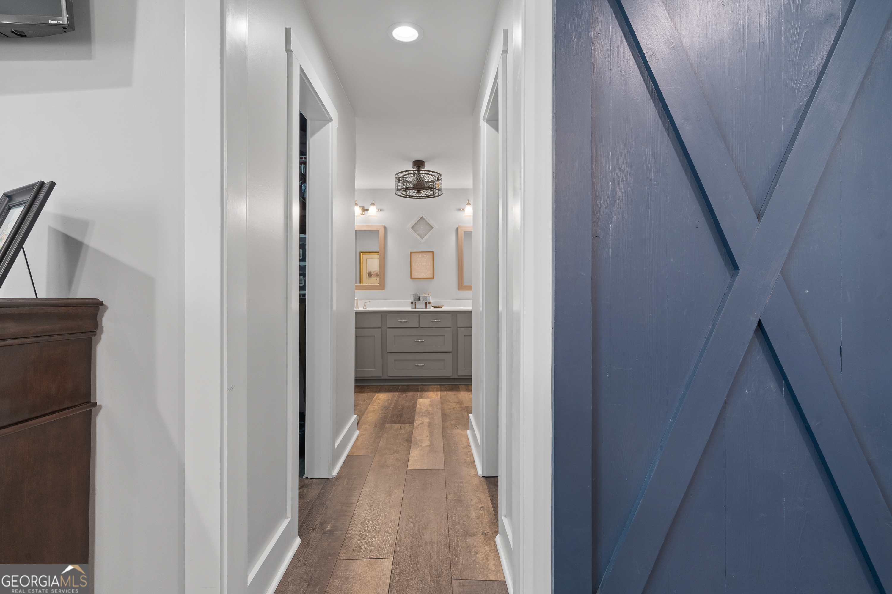 122 Ivey Weaver Road Milledgeville, GA 31061 - Photo 45 of 64 a view of a hallway with wooden floor and staircase