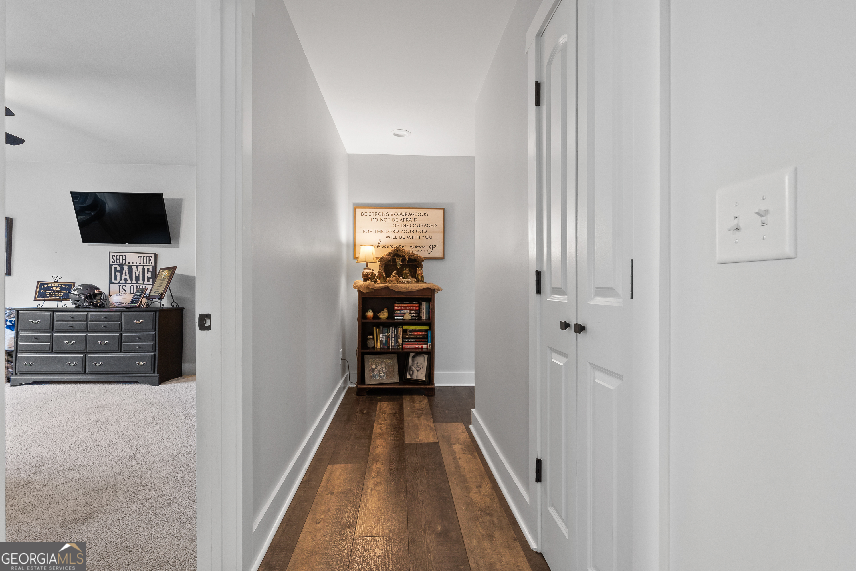 122 Ivey Weaver Road Milledgeville, GA 31061 - Photo 49 of 64 a view of a hallway with wooden floor and closet