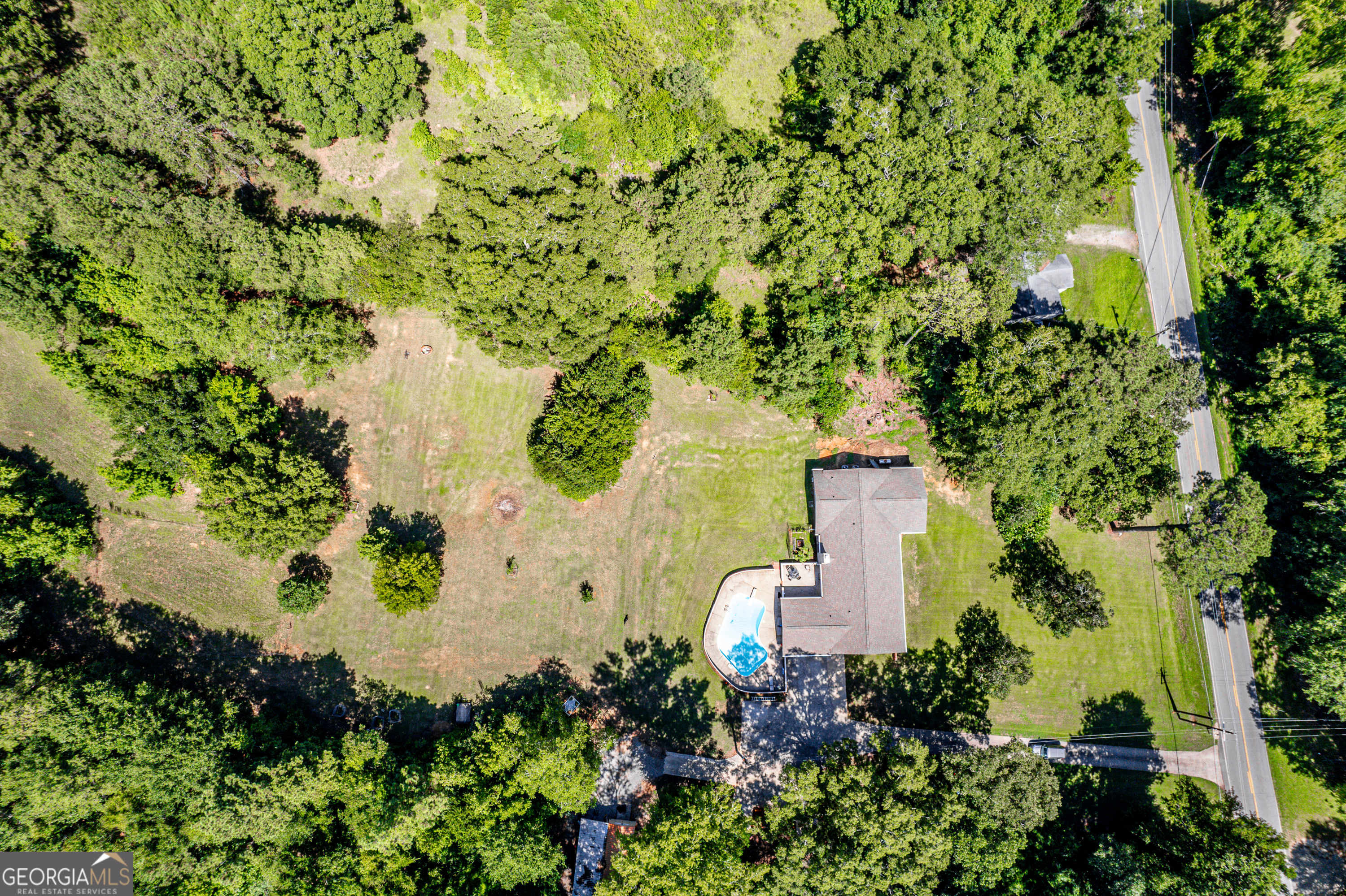 122 Ivey Weaver Road Milledgeville, GA 31061 - Photo 5 of 64 an aerial view of a house with a yard and garden