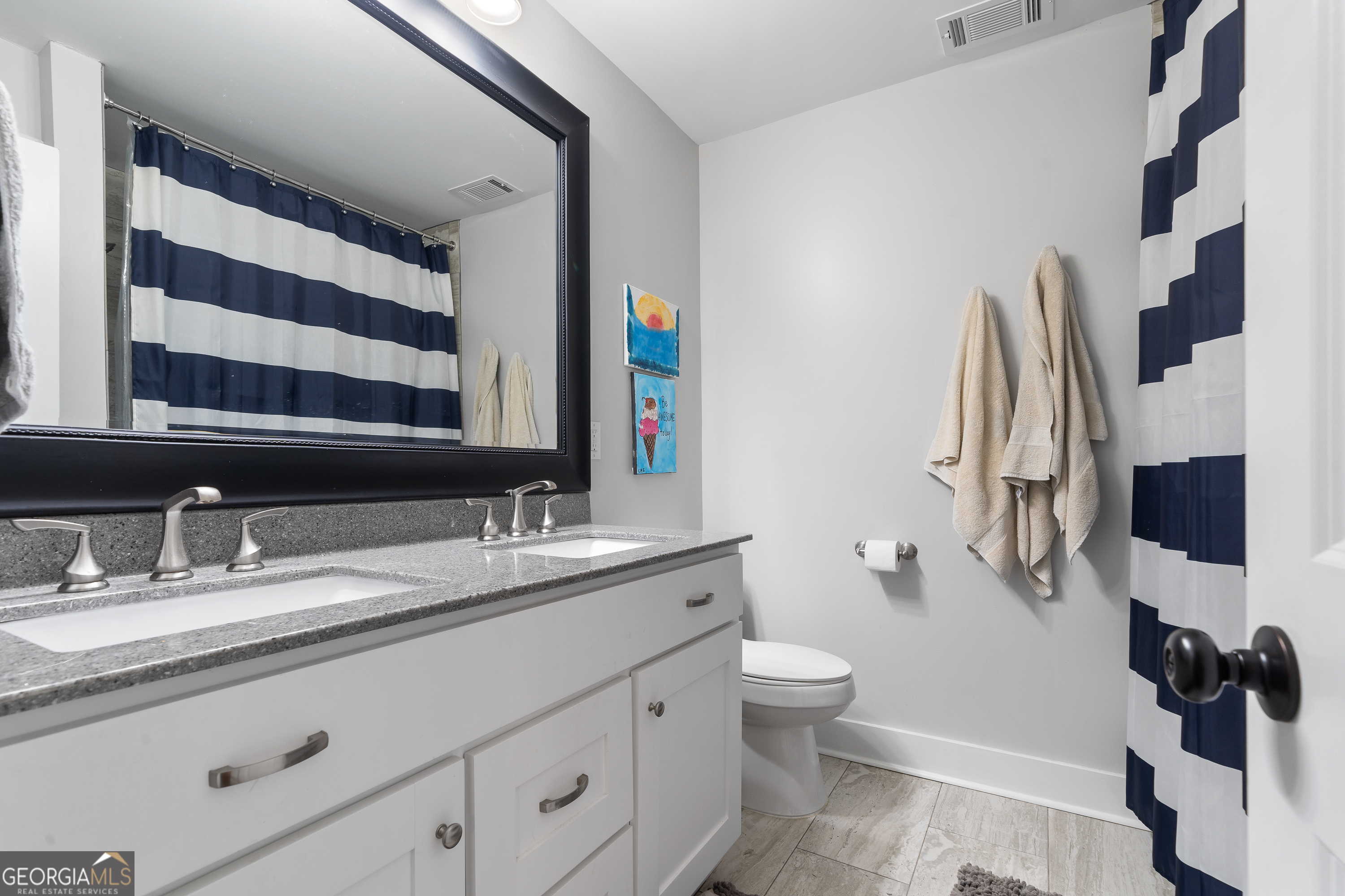 122 Ivey Weaver Road Milledgeville, GA 31061 - Photo 54 of 64 a bathroom with a granite countertop sink and a mirror