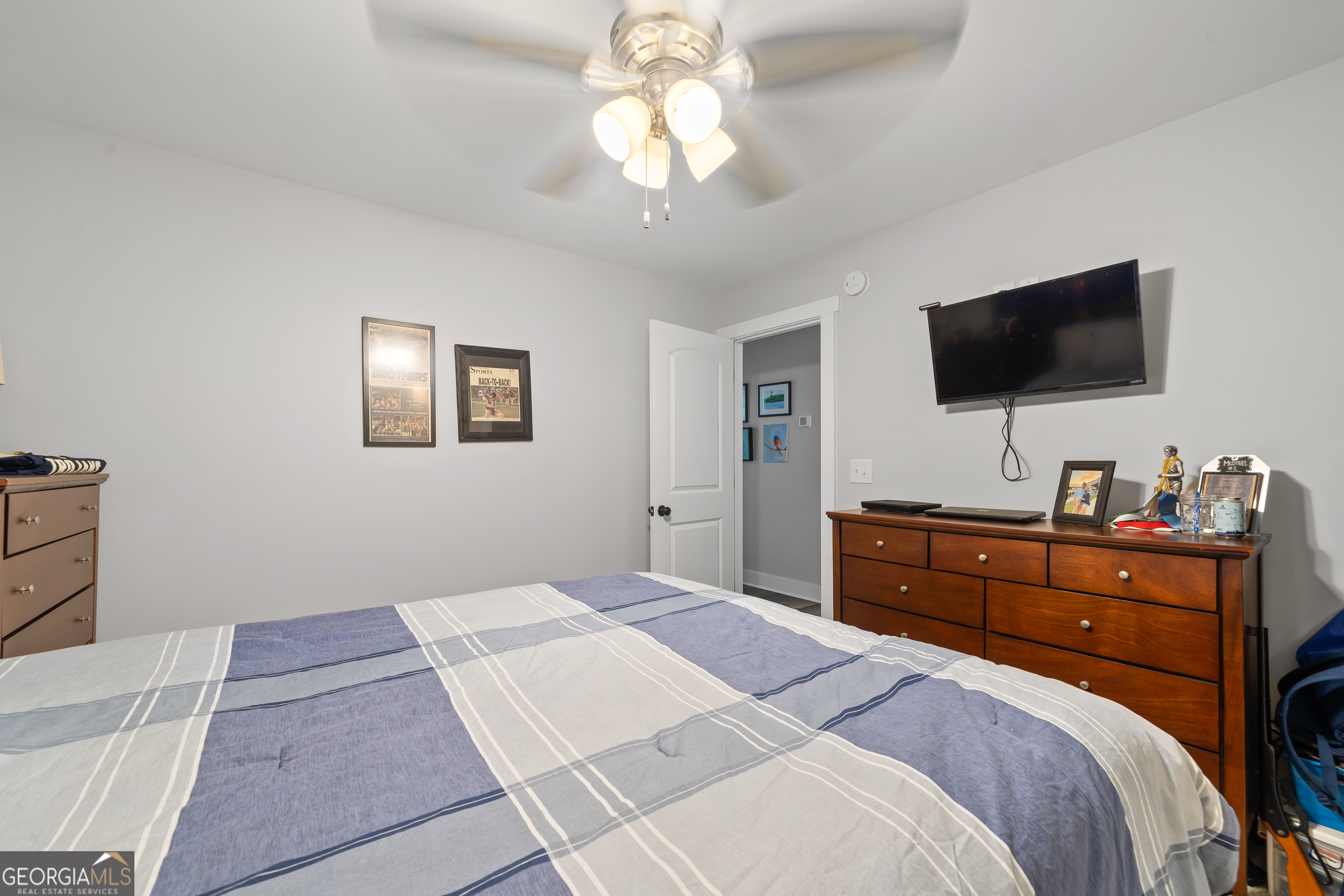 122 Ivey Weaver Road Milledgeville, GA 31061 - Photo 56 of 64 a bedroom with a bed and a flat screen tv