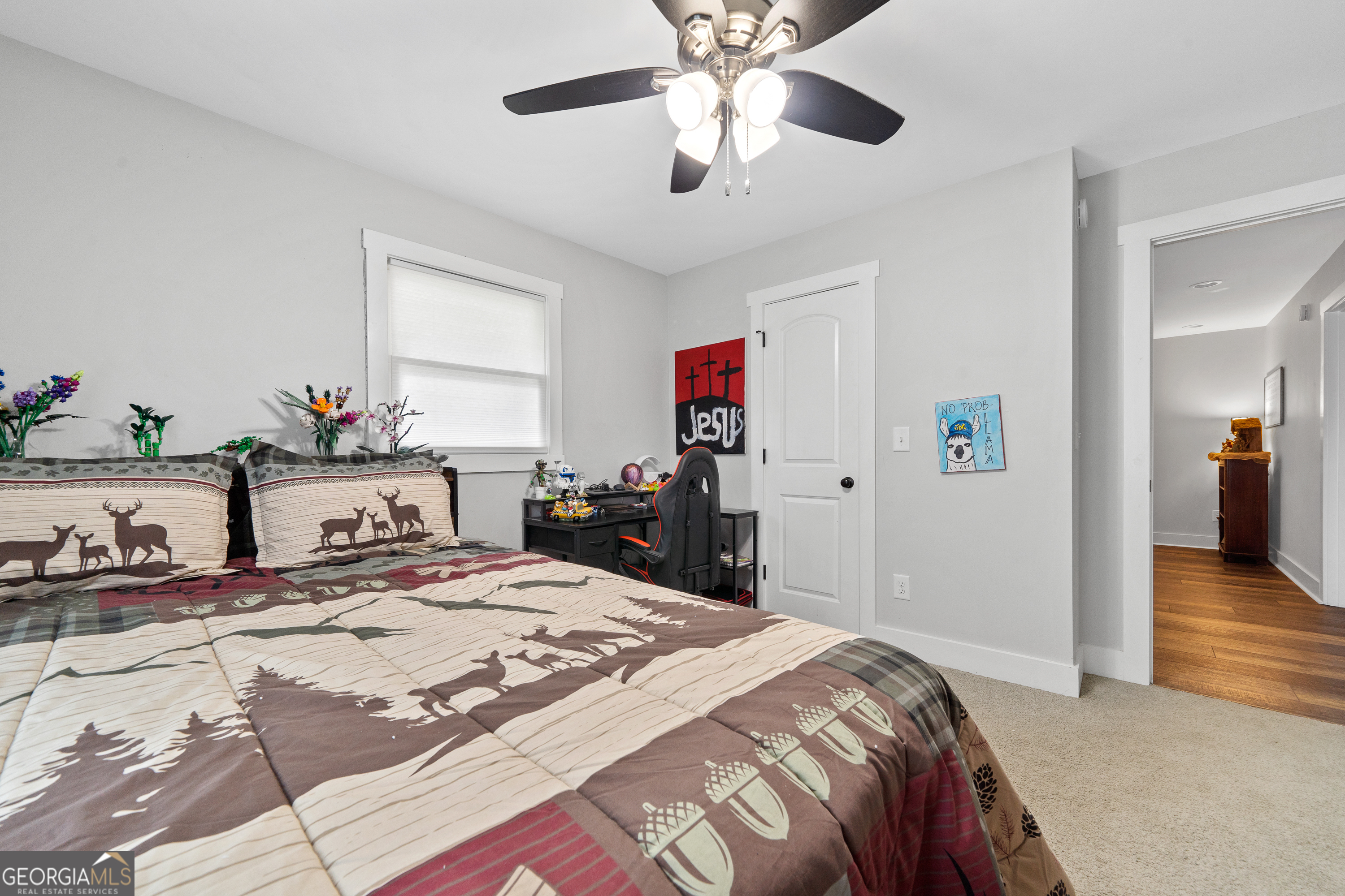 122 Ivey Weaver Road Milledgeville, GA 31061 - Photo 58 of 64 a bedroom with a bed and a chandelier