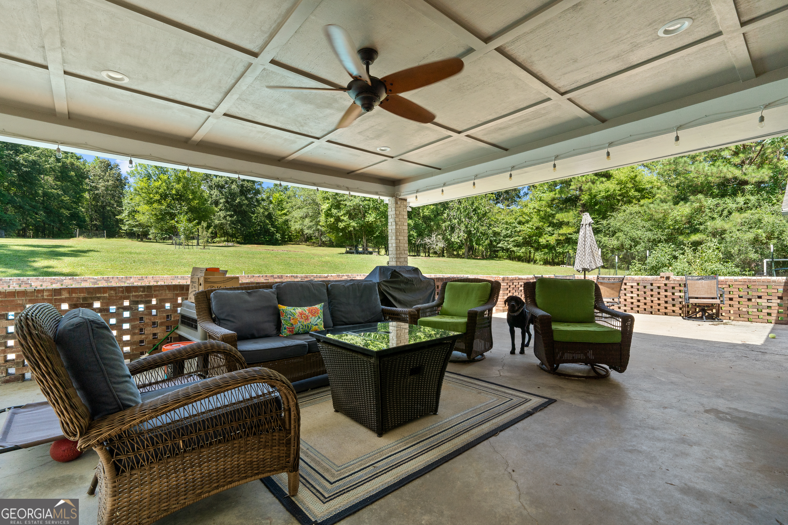 122 Ivey Weaver Road Milledgeville, GA 31061 - Photo 64 of 64 a balcony with furniture and a garden