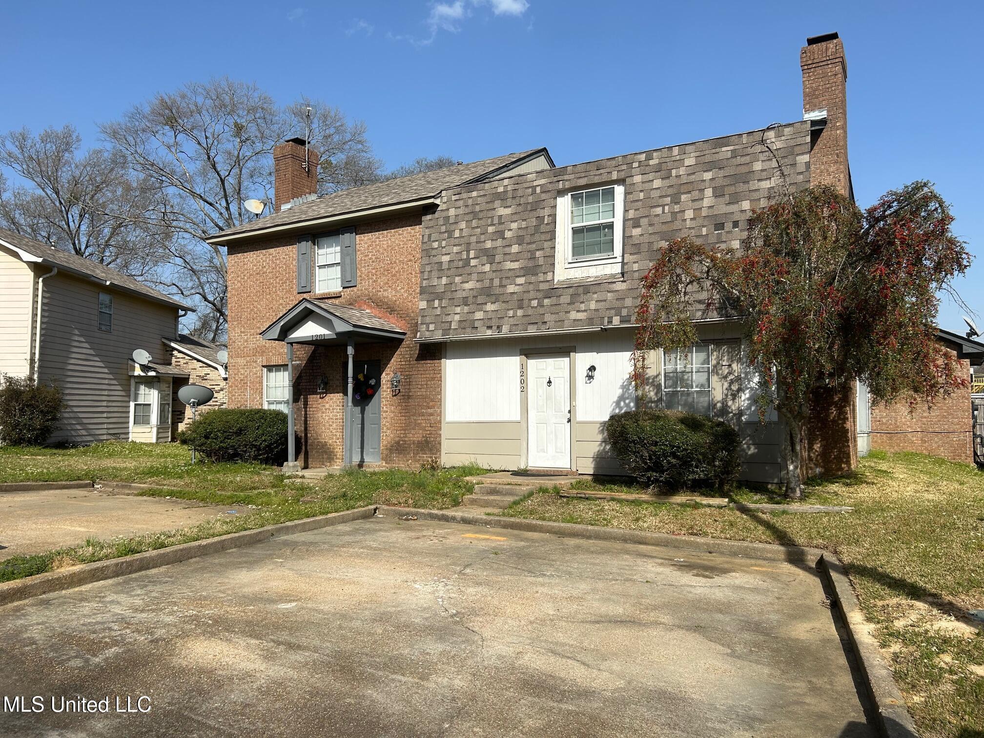 1201-1202 Jamestown Way Jackson, MS 39211 - Photo 1 of 11 Front