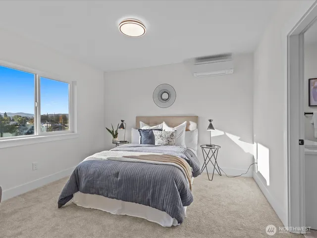 a bedroom with bed and a window