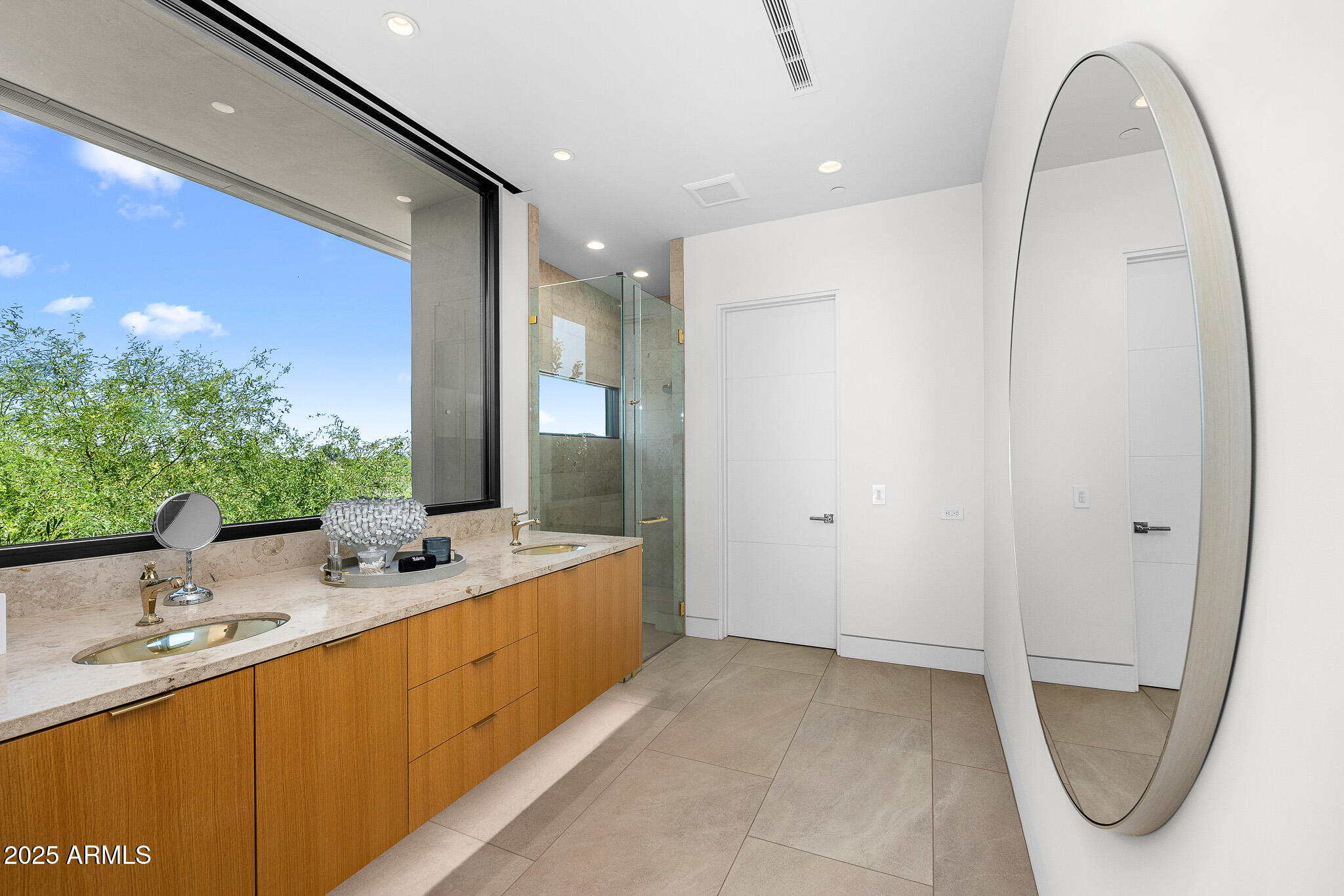 6149 East Indian Bend Road Paradise Valley, AZ 85253 - Photo 52 of 77 a bathroom with a double vanity sink mirror and bathtub
