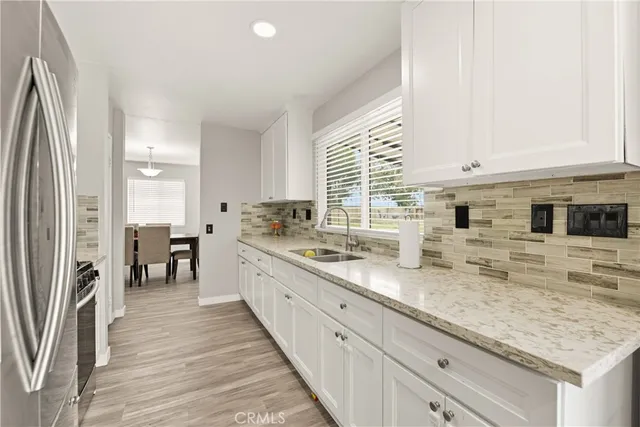 a kitchen with lot of counter space and a sink