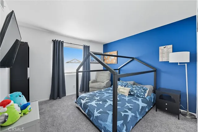 a bed room with a bed and a window