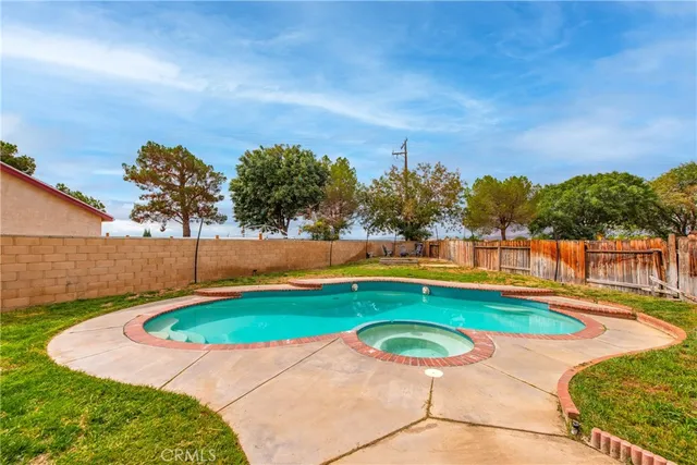 a view of swimming pool with a yard