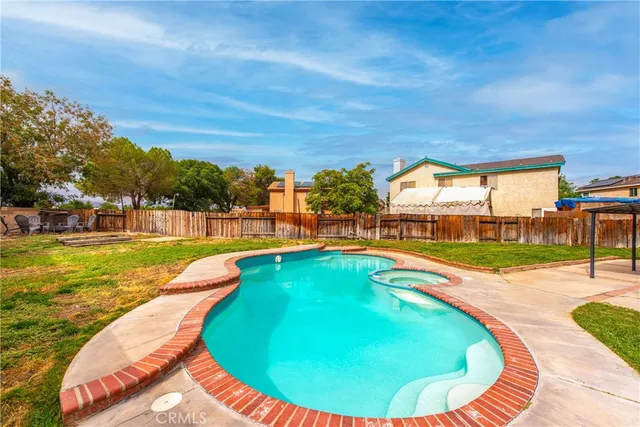 a view of swimming pool with outdoor seating