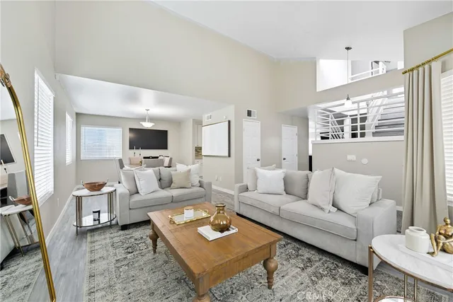 a living room with furniture and a rug