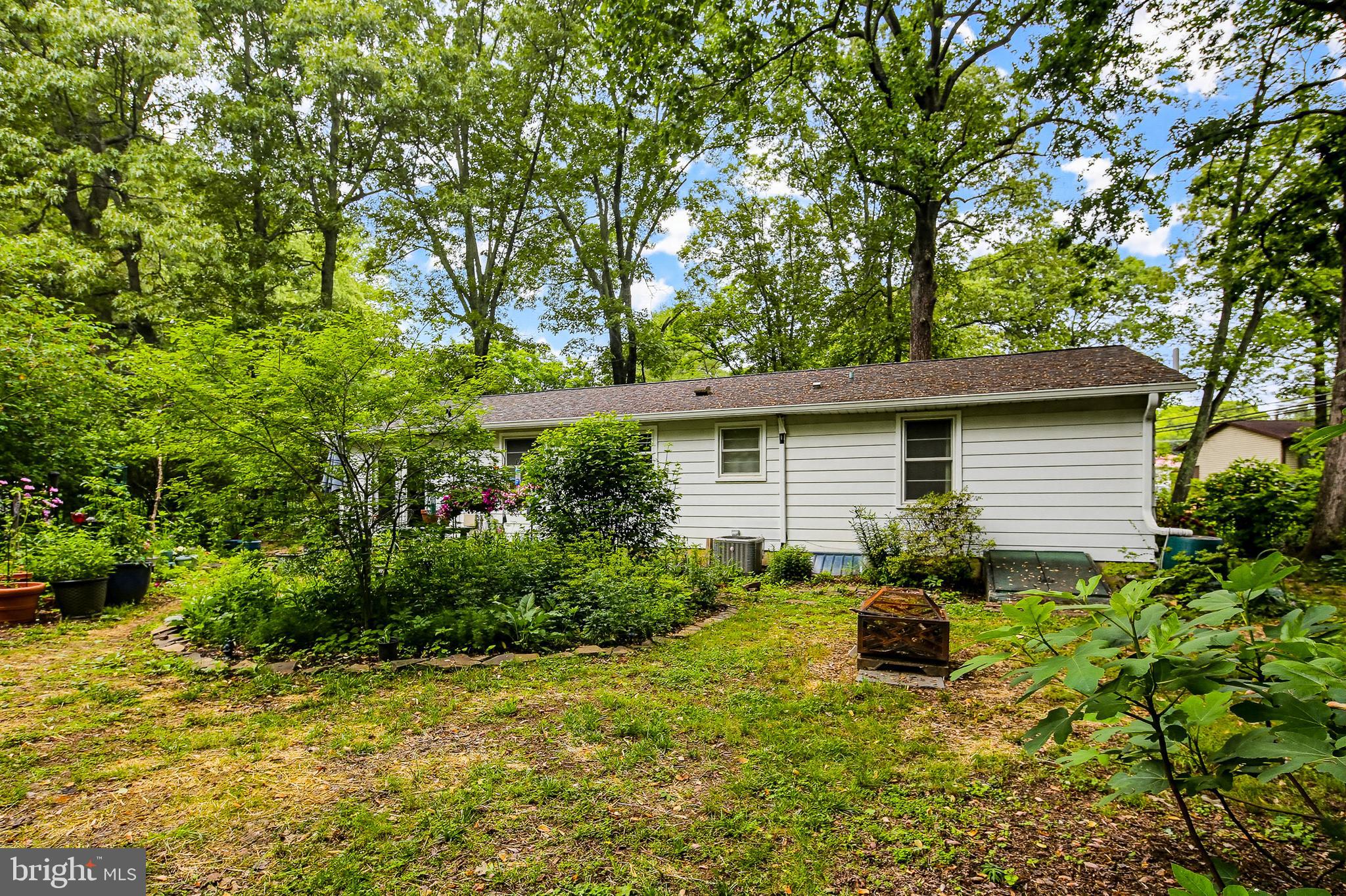 919 Blue Ridge Drive Annapolis, MD 21409 - Photo 6 of 30 a backyard of a house with yard and outdoor seating
