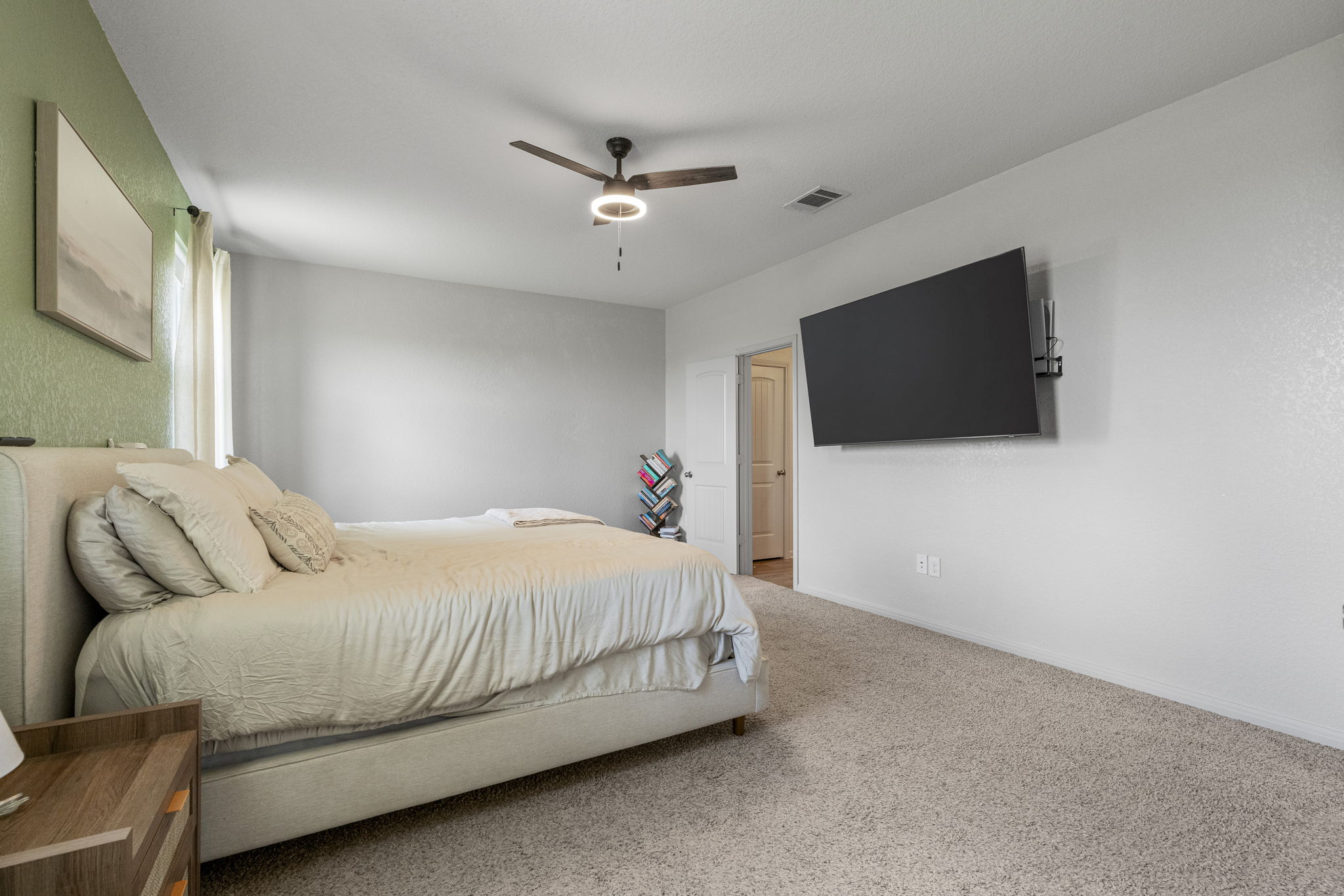 185 Struss Drive Georgetown, TX 78626 - Photo 12 of 23 Relax in this tranquil bedroom featuring soft carpeting and a contemporary ceiling fan.