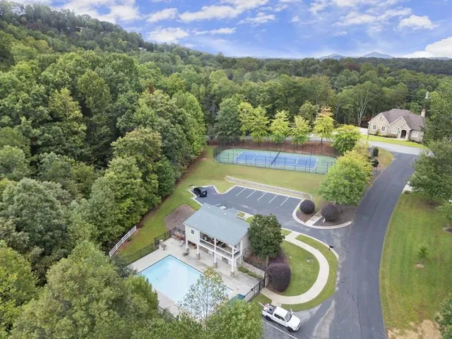 an aerial view of a house with a swimming pool