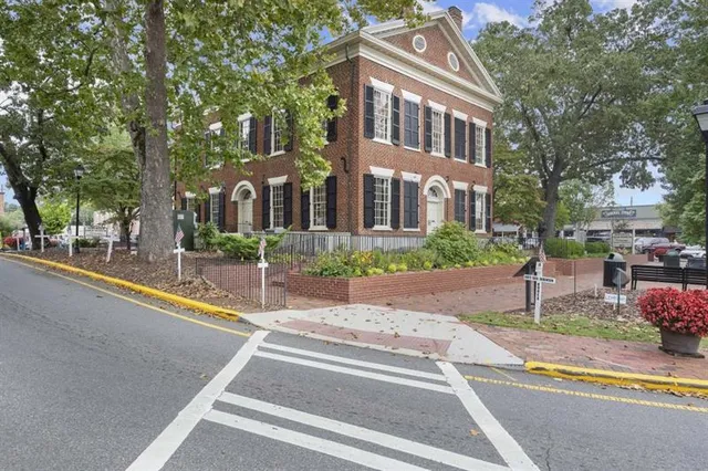 a front view of a building with street view