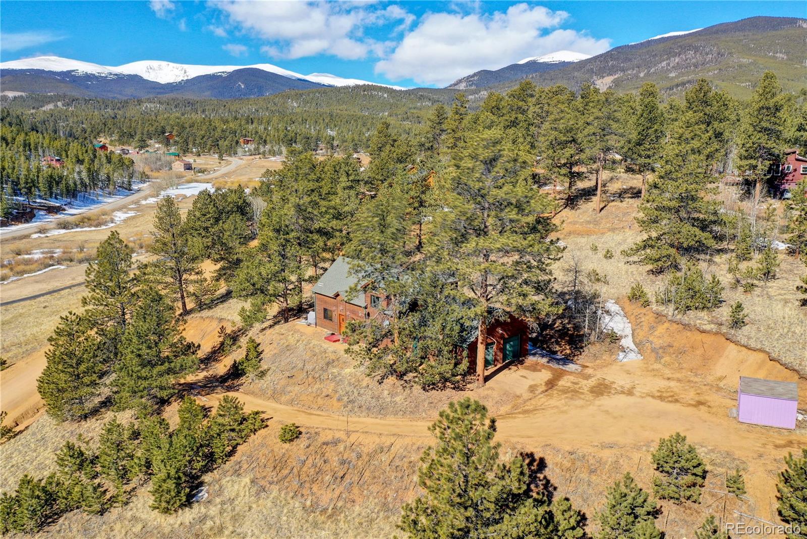 311 North Random Road Bailey, CO 80421 - Photo 1 of 40 a view of mountain with an lake view