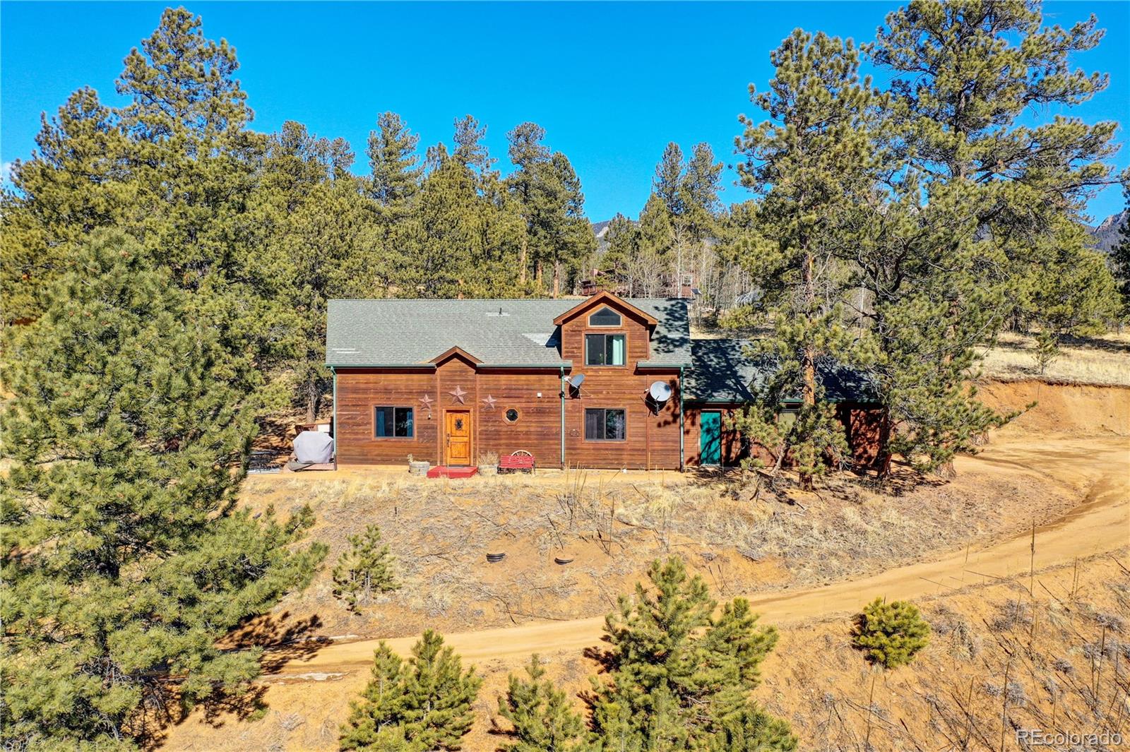 311 North Random Road Bailey, CO 80421 - Photo 2 of 40 front view of a house with a yard