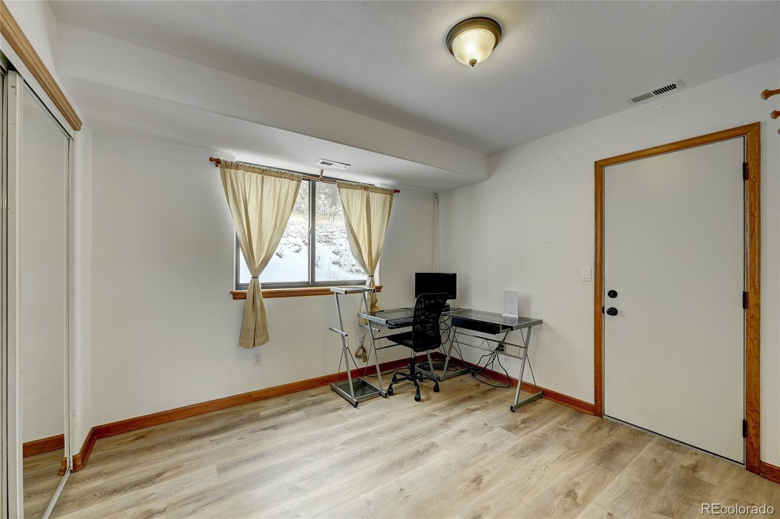 311 North Random Road Bailey, CO 80421 - Photo 23 of 40 a view of workspace with a window