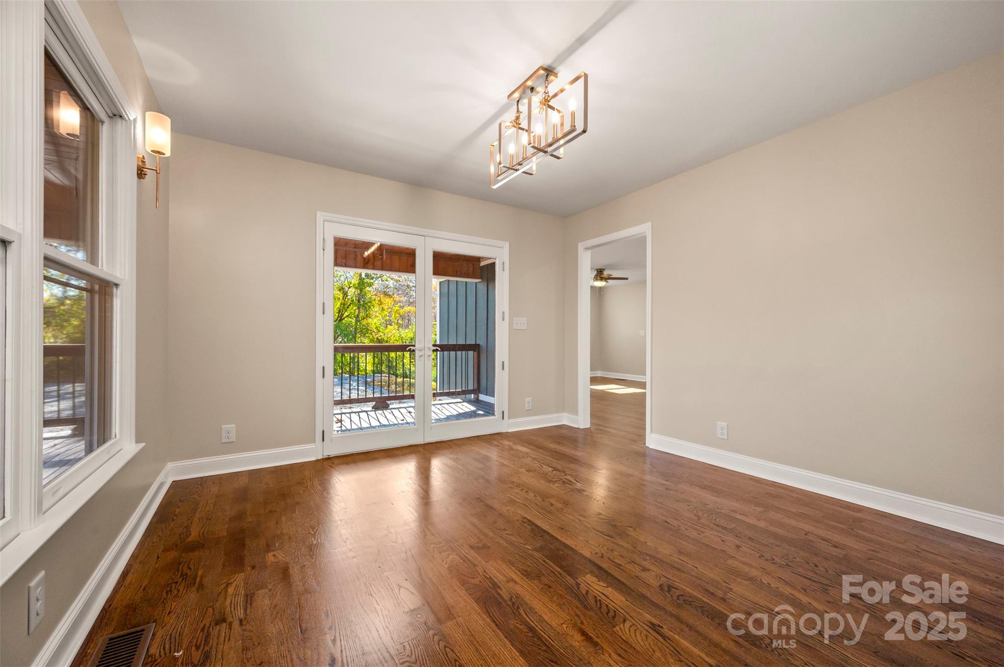 1121 Cove Road Rutherfordton, NC 28139 - Photo 11 of 41 a view of an empty room with wooden floor and a window