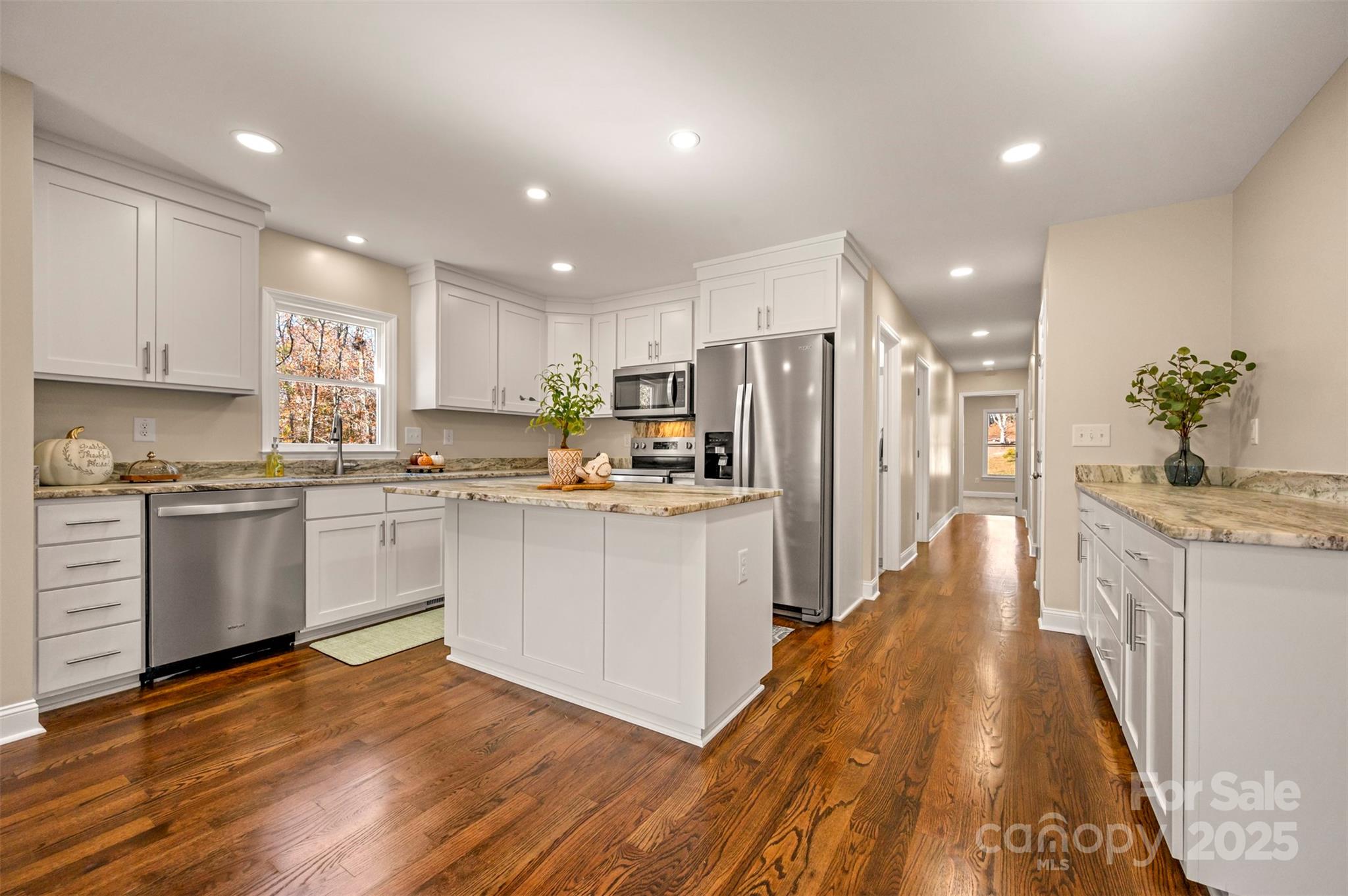 1121 Cove Road Rutherfordton, NC 28139 - Photo 15 of 41 a kitchen with white cabinets and stainless steel appliances