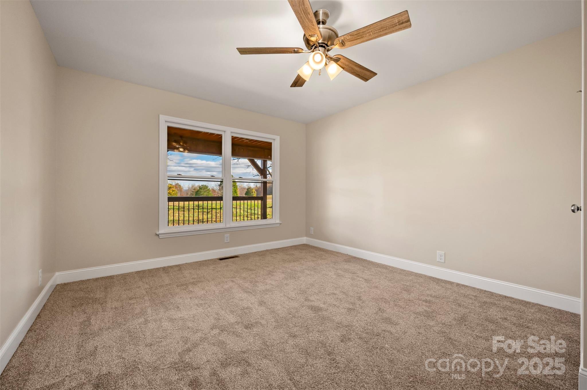1121 Cove Road Rutherfordton, NC 28139 - Photo 20 of 41 an empty room with windows and fan
