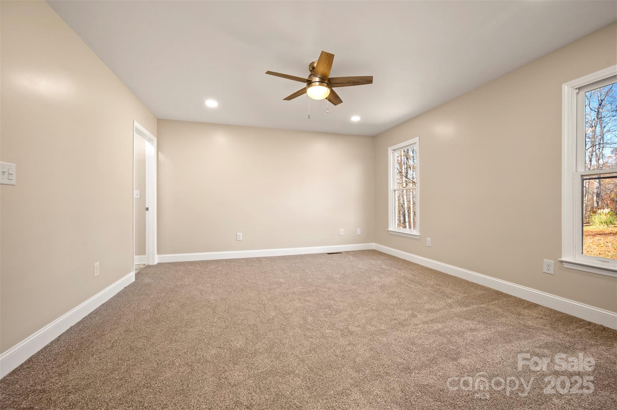 1121 Cove Road Rutherfordton, NC 28139 - Photo 23 of 41 an empty room with windows and ceiling fan
