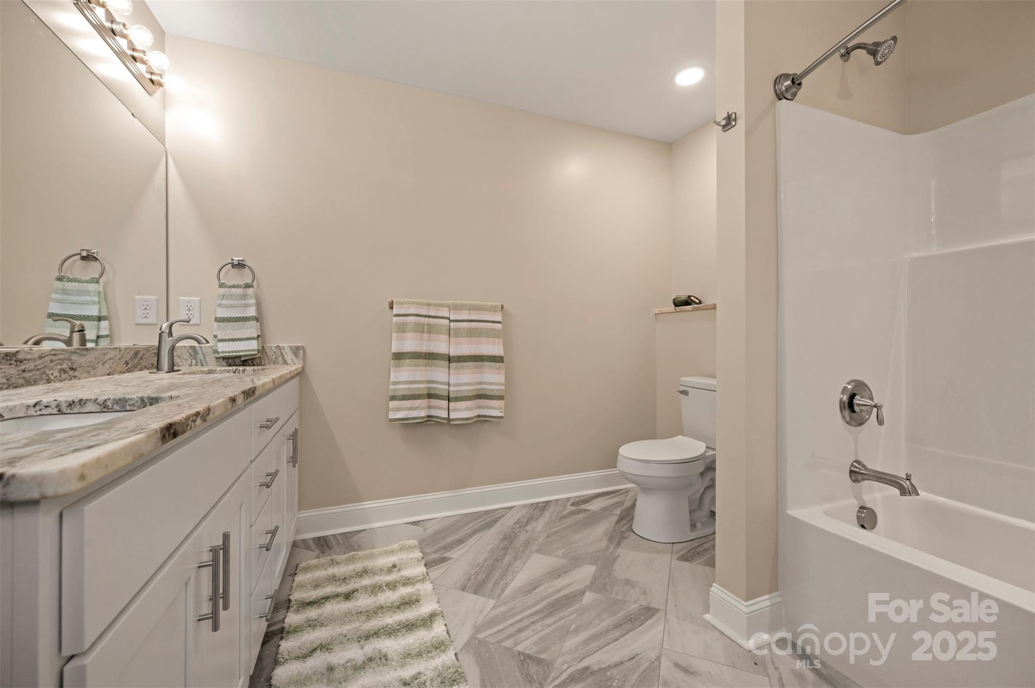 1121 Cove Road Rutherfordton, NC 28139 - Photo 25 of 41 a bathroom with a granite countertop sink toilet and shower