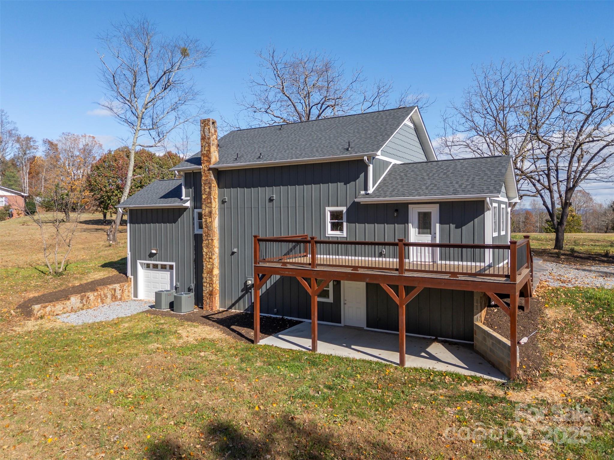 1121 Cove Road Rutherfordton, NC 28139 - Photo 35 of 41 a view of house with outdoor seating and covered with trees