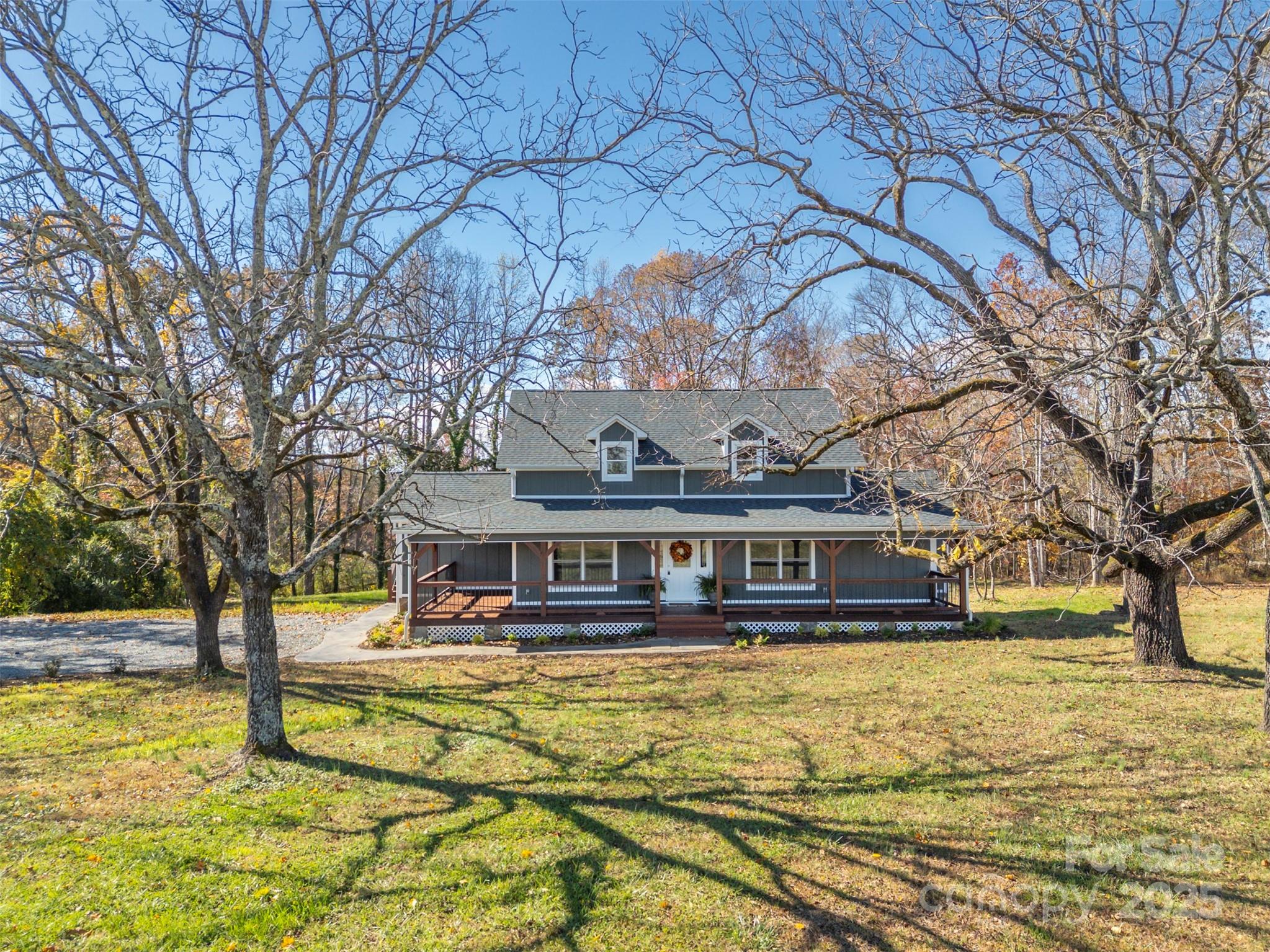 1121 Cove Road Rutherfordton, NC 28139 - Photo 7 of 41 a view of a swimming pool with trees and sitting area