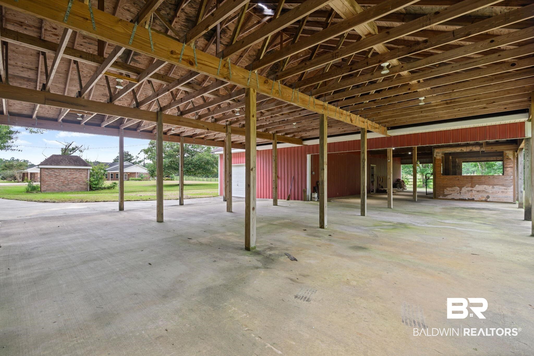 7540 2 Mile Road Irvington, AL 36544 - Photo 62 of 82 Expansive covered concrete pad with exposed wood beam ceiling