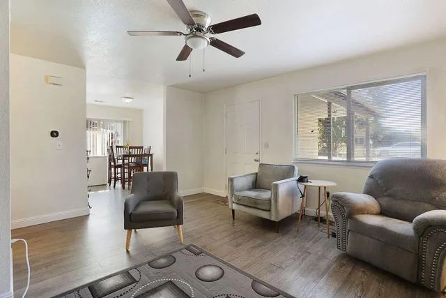 a living room with furniture and a large window