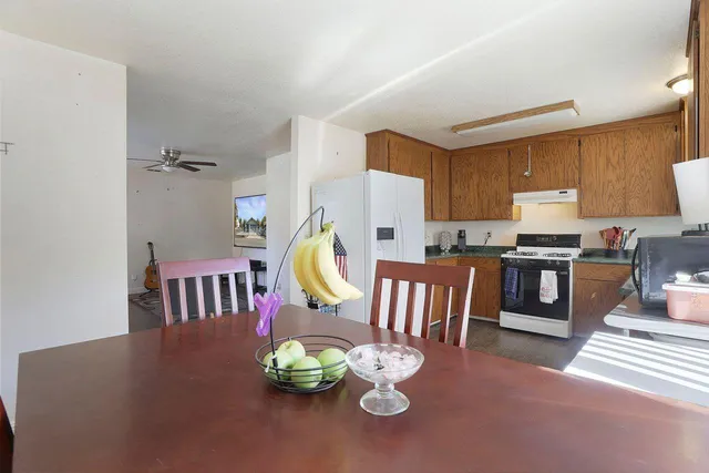 a view of kitchen with furniture and wooden floor