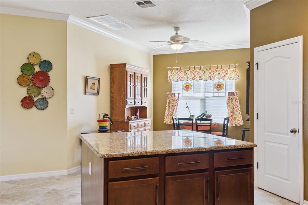 12332 Hammock Pointe Circle Clermont, FL 34711 - Photo 22 of 39 a bathroom with a granite countertop sink a mirror and a shower