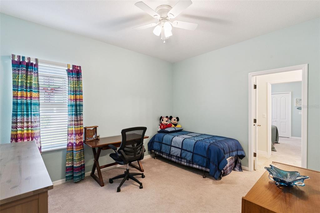 12332 Hammock Pointe Circle Clermont, FL 34711 - Photo 26 of 39 a living room with furniture and a wooden floor