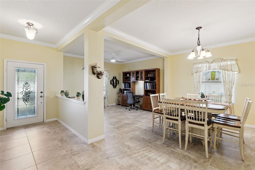 12332 Hammock Pointe Circle Clermont, FL 34711 - Photo 3 of 39 a view of a dining room with furniture and window