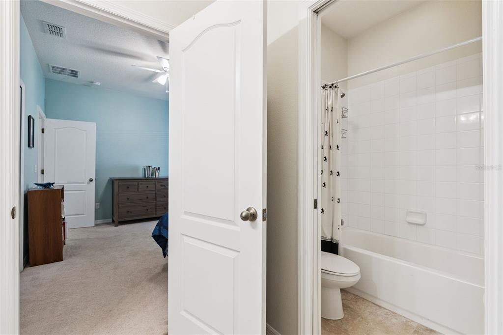 12332 Hammock Pointe Circle Clermont, FL 34711 - Photo 32 of 39 a bathroom with a toilet a sink and bathtub