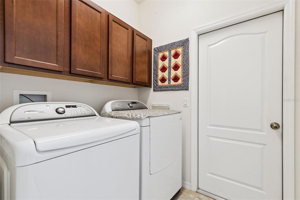 12332 Hammock Pointe Circle Clermont, FL 34711 - Photo 33 of 39 a utility room with dryer and washer